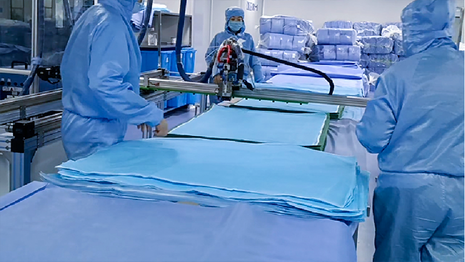 捷隆兴自动喷胶机助力驼人集团解决医用垫单、手术衣贴防污片制作难题 